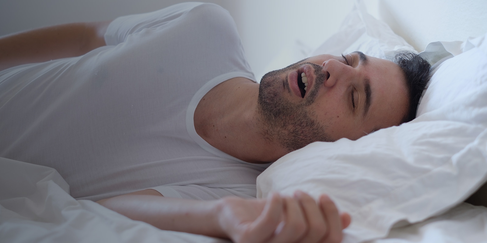 A man sleeping and snoring.