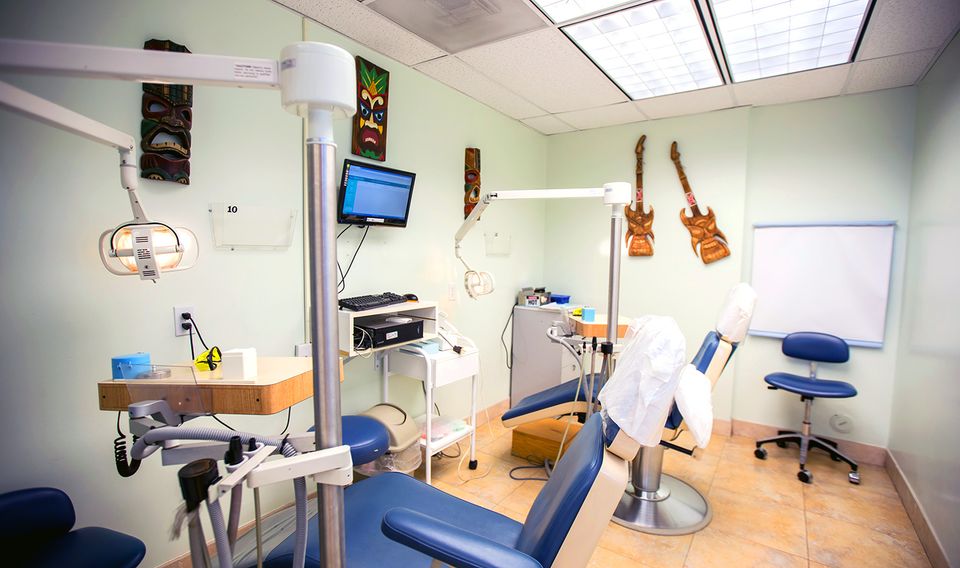 A dental treatment room with two dental chairs.