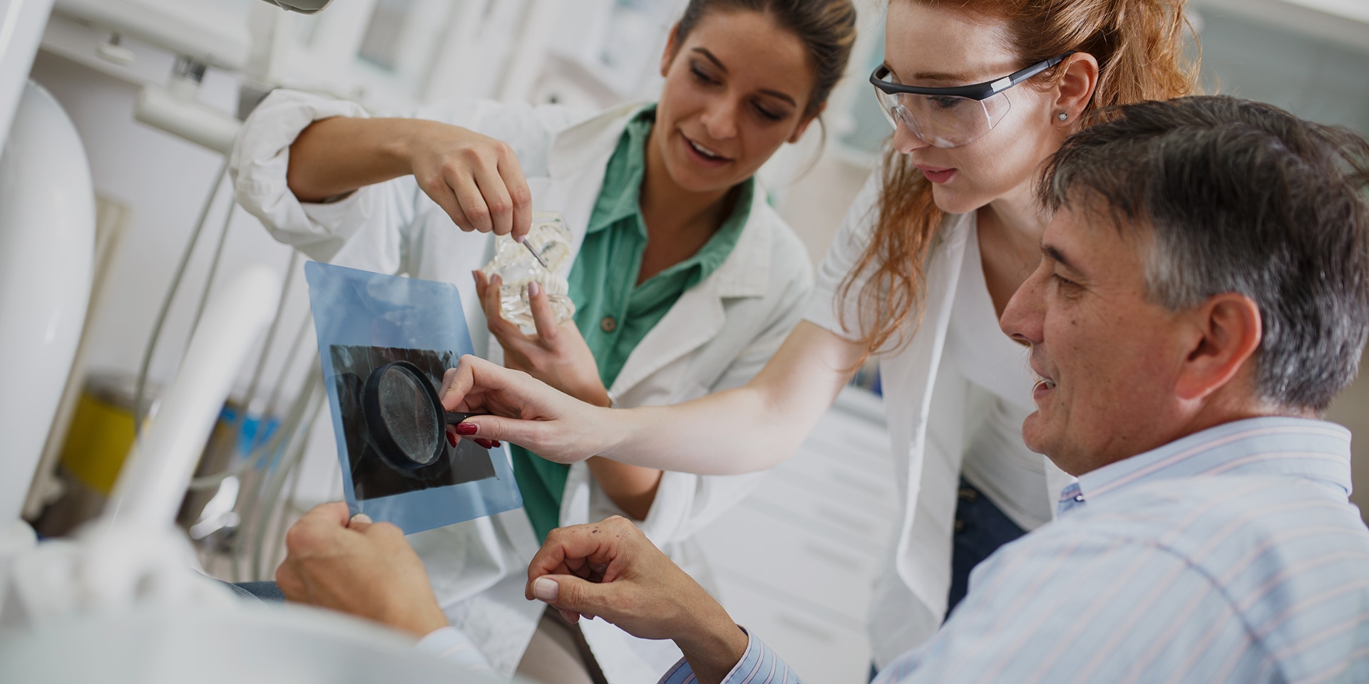 Three dentists working together.