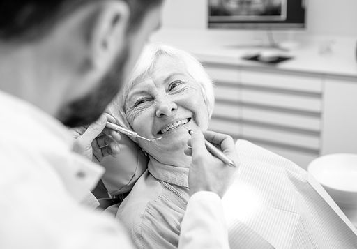 Older woman smiling to the dentist.