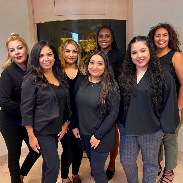 A group of women from the Bellflower Dental Group team.